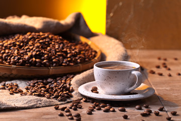Cup of black coffee and  beans