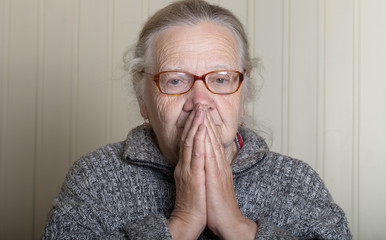 Portrait of elderly woman in glasses