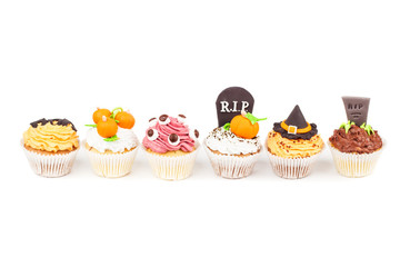 Halloween cupcakes with colored decorations