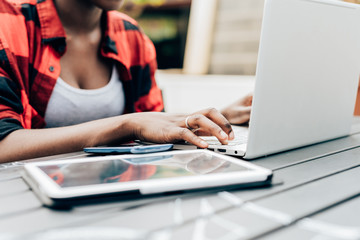 Midsection of woman working on laptop