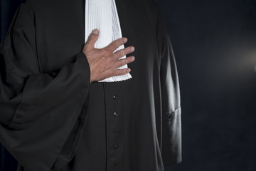 Lawyer in gown with jabot hands close up judge