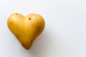 Close-up photo of potato in a shape of heart