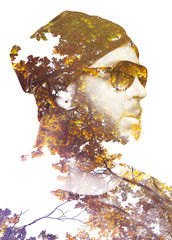 Double exposure portrait of male combined with branches and trees. Gradient effect applied. Vintage look.