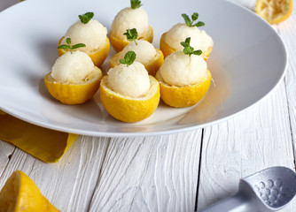 Lemon sorbet or ice cream inside fresh lemons