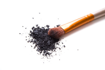 Professional makeup brush and loose powder eyeshadows isolated