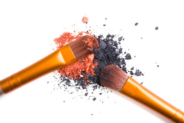 Professional makeup brushes set and loose powder eyeshadows isol