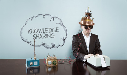 Cloud knowledge sharing text with vintage businessman at office