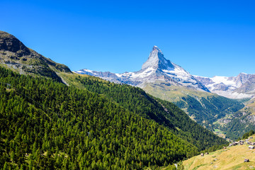 Fototapeta premium Matterhorn - small village with houses in beautiful landscape of Zermatt, Switzerland