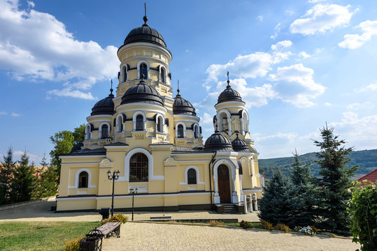 Photo of Capriana Monastery in Moldova with blue sky