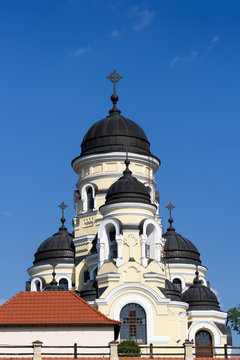 Photo of Capriana Monastery in Moldova with blue sky