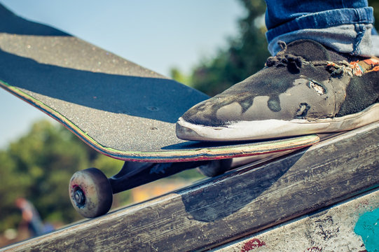Closeup of skateboarder legs