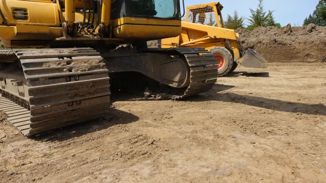 Construction worker driving excavation equipment