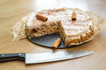 Home made apple and cinnamon pie with cottage cheese dusted with cocoa powder
