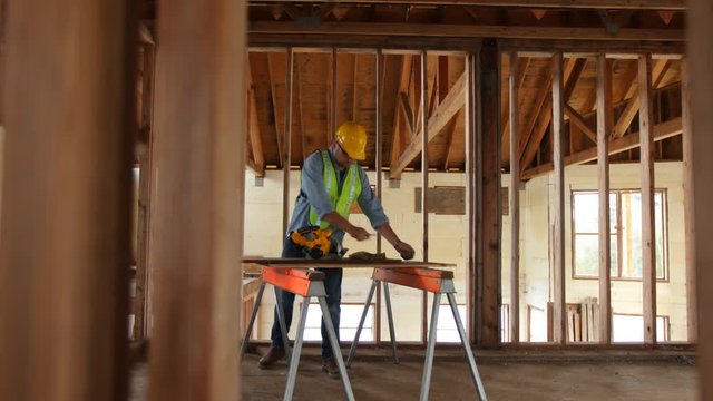 Construction worker building home