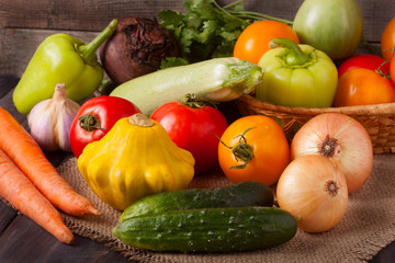 harvest of vegetables on a wooden background