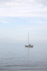 Obraz premium Boat at Sea, Cushendun; County Antrim