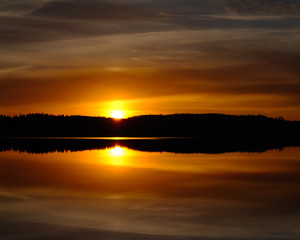 Fototapeta na wymiar Panorama of sunset over the lake