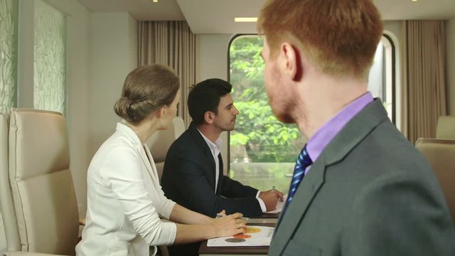 Business People Discussing Presentation
