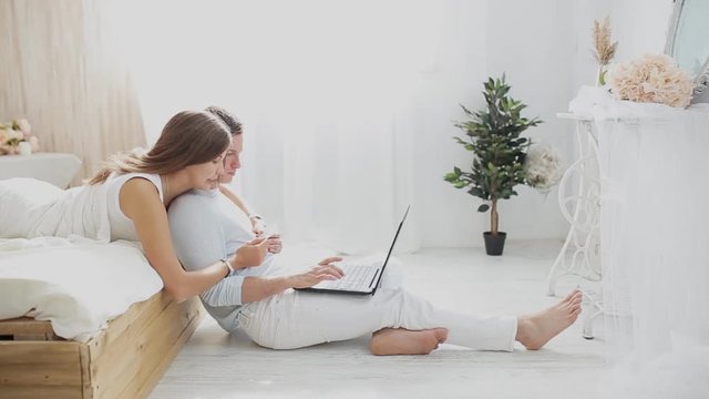 couple with laptop and card to buy online at home