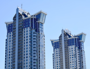 Fototapeta na wymiar Blue skyscrapers facade. office buildings. Modern glass silhouet