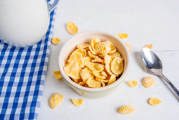 Light healthy breakfast: cornflakes and milk for them. Close view