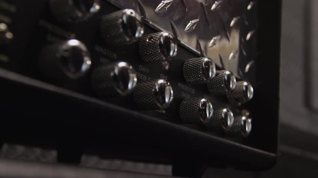 Heavy metal rock band- closeup of knobs on amplifier