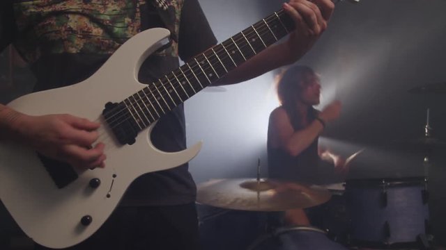 Guitar and Drums in heavy metal rock band