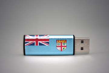 usb flash drive with the national flag of Fiji on gray background.