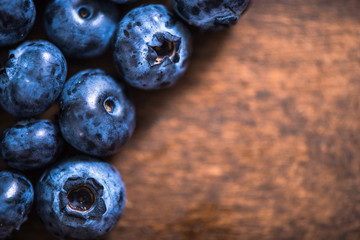 Blueberries on wooden background, macro close up