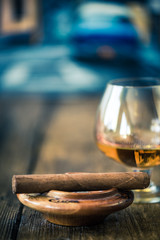 cuban cigar and glass of rum or cognac