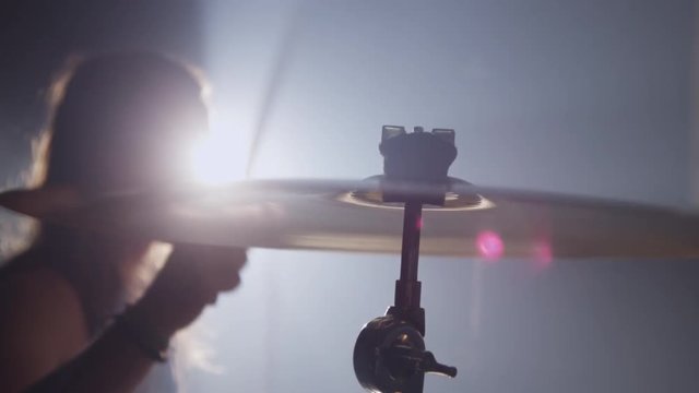 Cymbal closeup in heavy metal rock band, slow motion