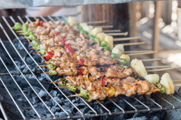 Grilling shashlik on barbecue grill