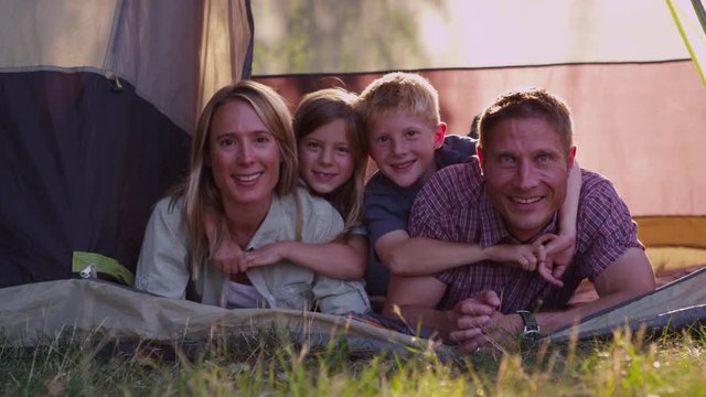 Portrait of camping family in tent