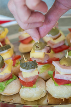 bruschetti with cheese, olives, ham, cucumber and fingers