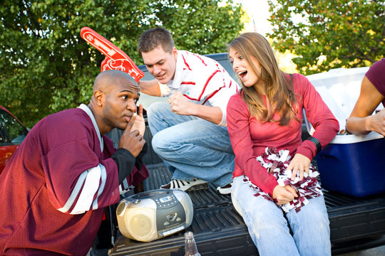Tailgating: Guy Listening Carefully To Radio To Hear Details Of
