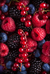 Berries assorted mix in studio on dark background