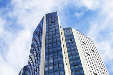 Fototapeta na wymiar High skyscraper with glass windows