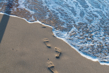 footsteps on a sandy beach