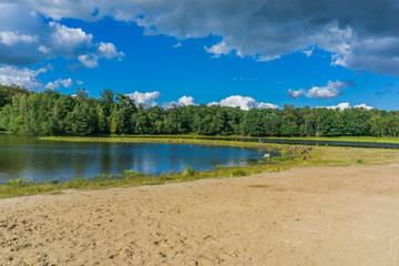 small water lakes with sand shore in the forest