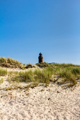 Lighthouse tower, beach and dunes with beachgrass