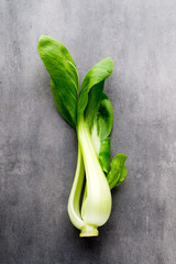 Fresh spinach on the gray background.