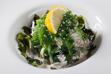 chuka salad with sesame seeds, lemon and nut sauce seaweed