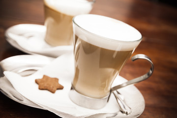 Glass mugs full of Cappuccino coffee