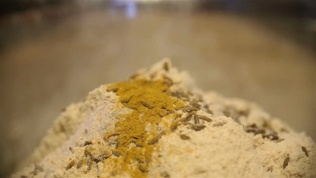 strew a flour hill with cumin by turmeric
