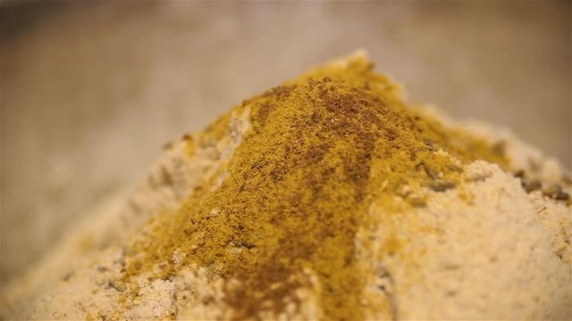 strew a flour hill with cumin and turmeric by spice