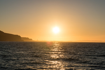 Obraz premium sun rising over mediterranean sea coast
