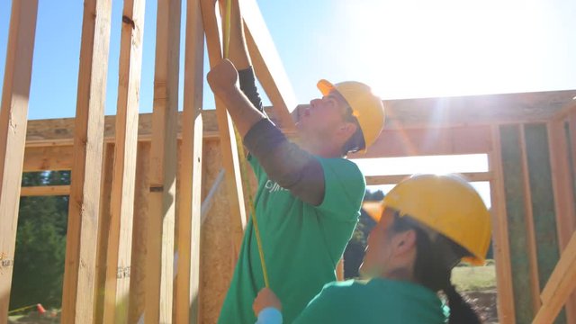 Volunteers Working Together On Construction Project