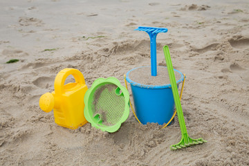 Child's toys on sandy beach, summer holidays concept 
