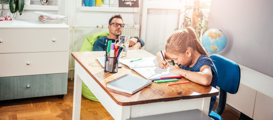 Obraz premium School Girl Doing Homework
