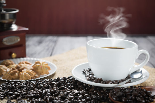 Coffee cup and beans on a rustic background. Coffee Espresso and